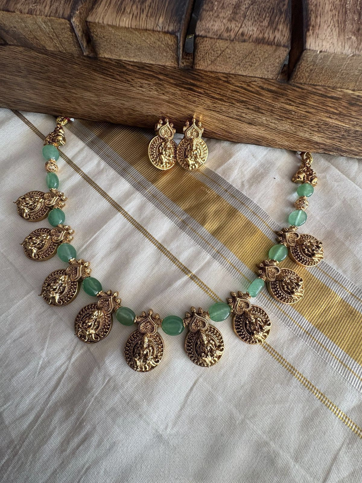 Lakshmi with green beads necklace